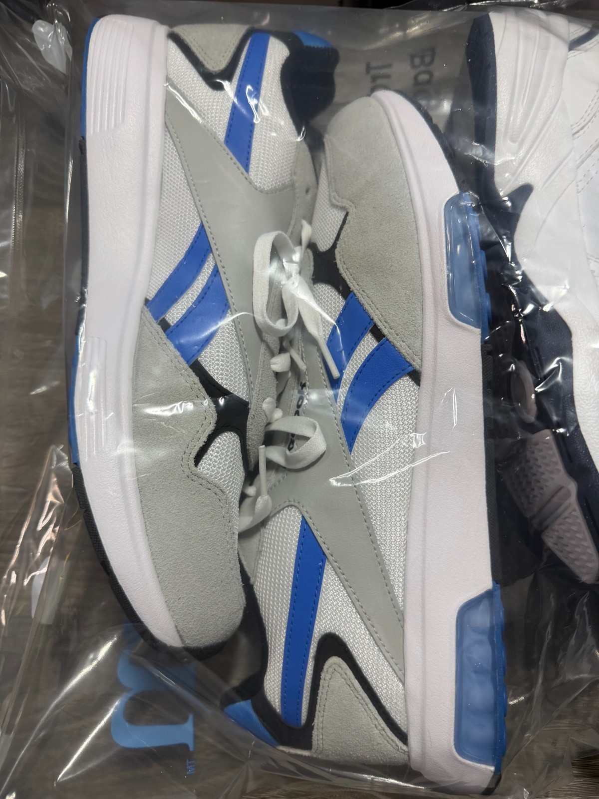2 Pairs of Sports Shoes | 1 Men&rsquo;s Size 12 Reebok | 1 Women&rsquo;s Size 7 Nike | New